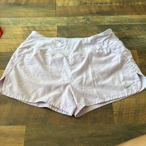 Light purple Nike running shorts. Back pocket thing. See photo 5 before purchase